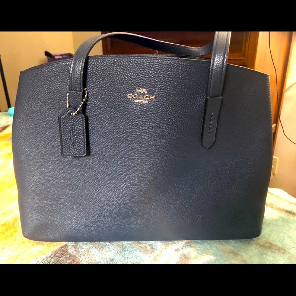 Coach. The Charlie Carryall. Polished pebble leather. Like new.  Hardly used